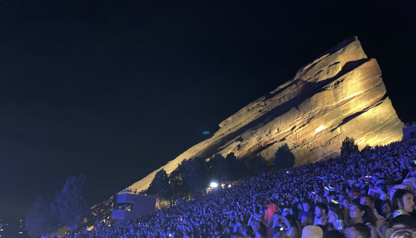 A summer concert crowd at Red Rocks Amphitheatre at night